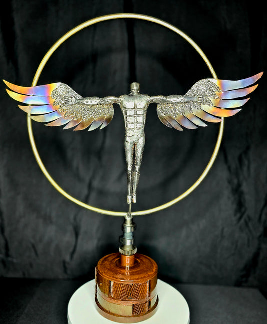 Metal angel figurine with spread wings and golden circular halo on round wooden base
