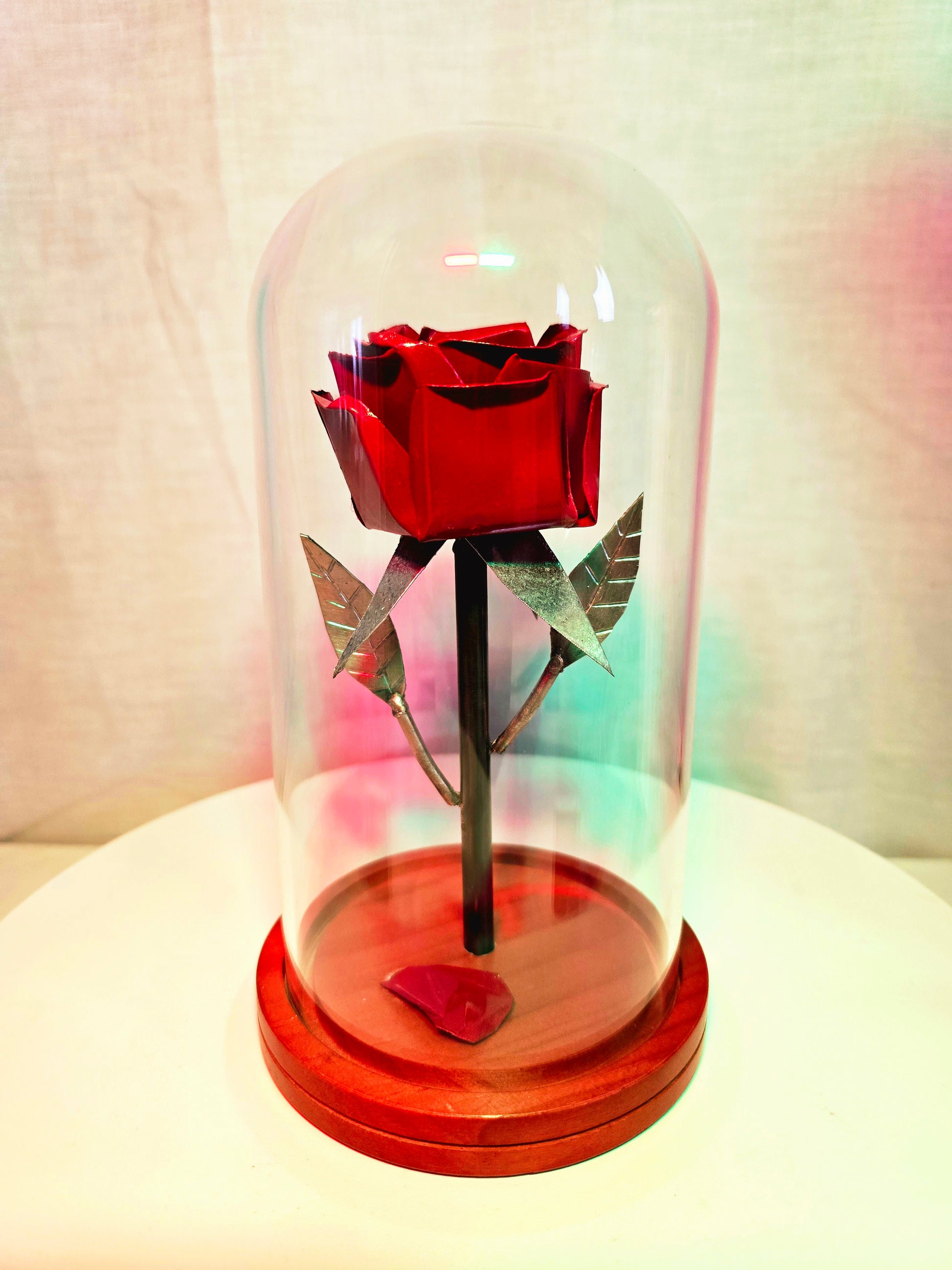 Rose inspired metal sculpture symbolizing beauty and enchantment, forged from reclaimed steel by Enrique Del Angel.