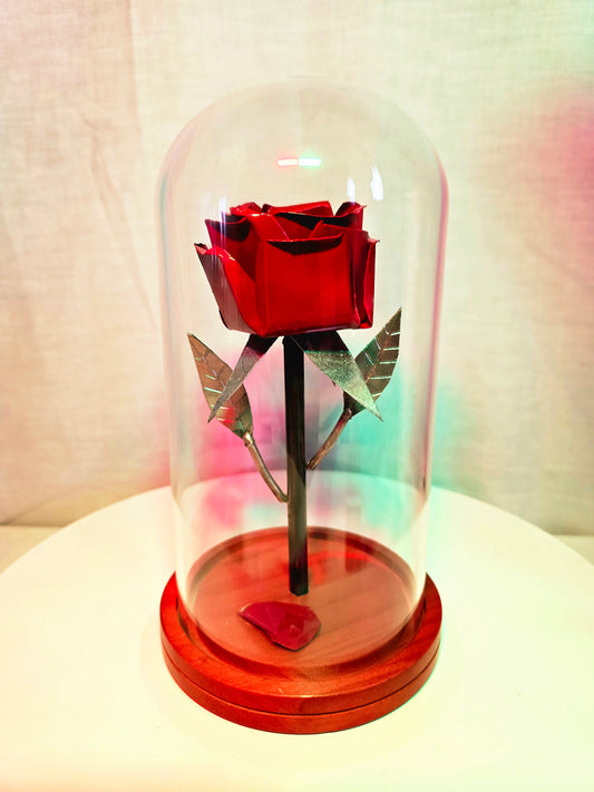 Rose inspired metal sculpture symbolizing beauty and enchantment, forged from reclaimed steel by Enrique Del Angel.