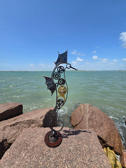 Kinetic sculpture, rotating, seahorse metal sculpture made from race car parts, timing chains, and reclaimed steel by Enrique Del Angel.