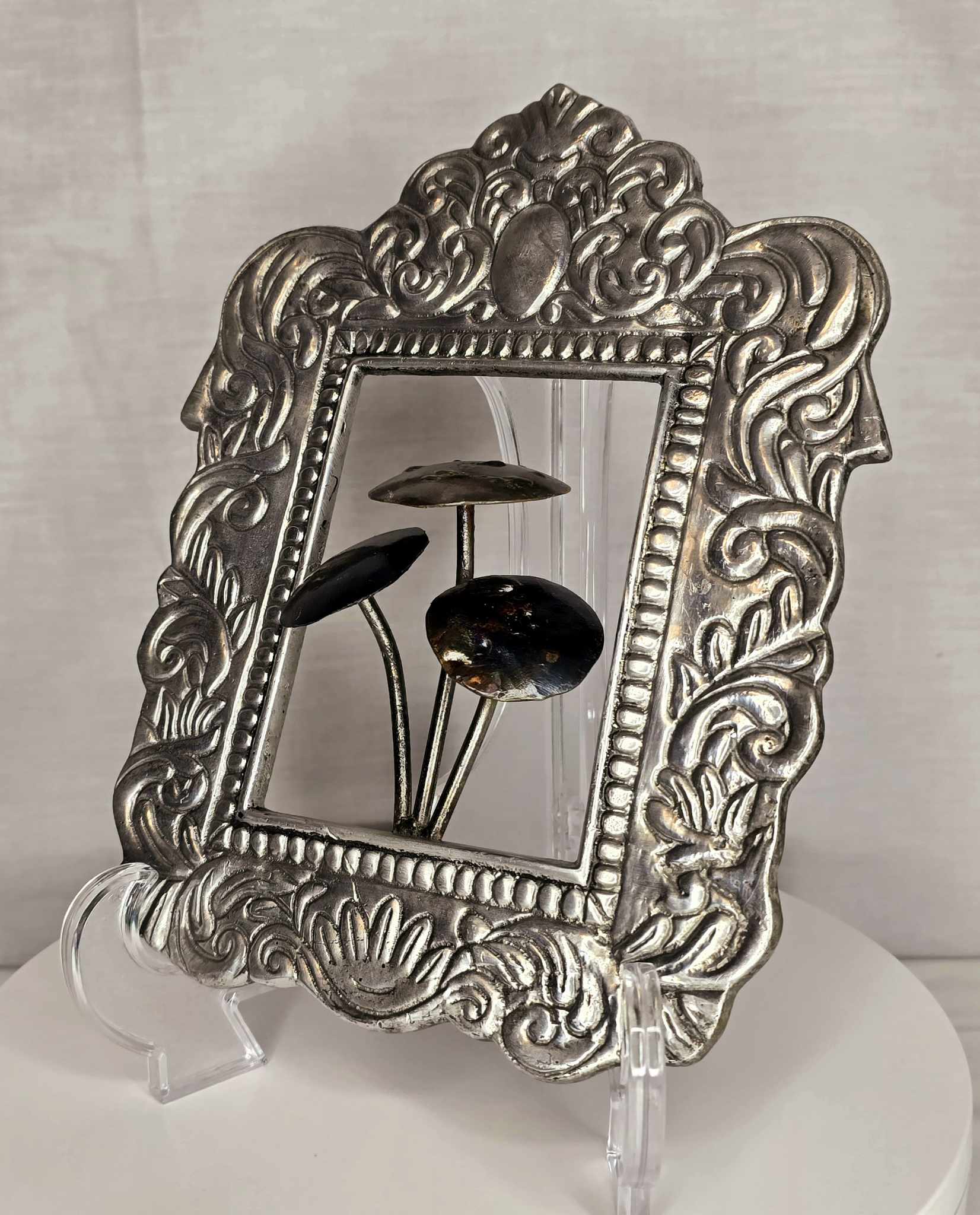 Mushroom of the Forge: Ornate silver-tone frame with three metallic mushrooms.
