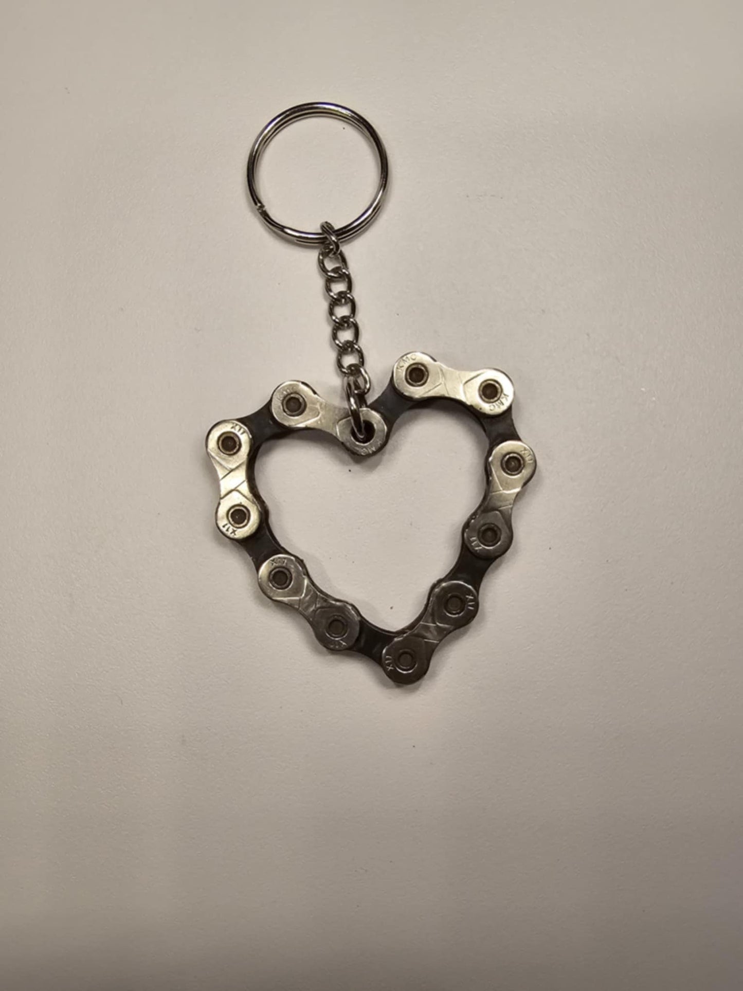 Pocket Sculptures welded steel heart keychain by Enrique Del Angel handcrafted from an upcycled mechanical bicycle chain