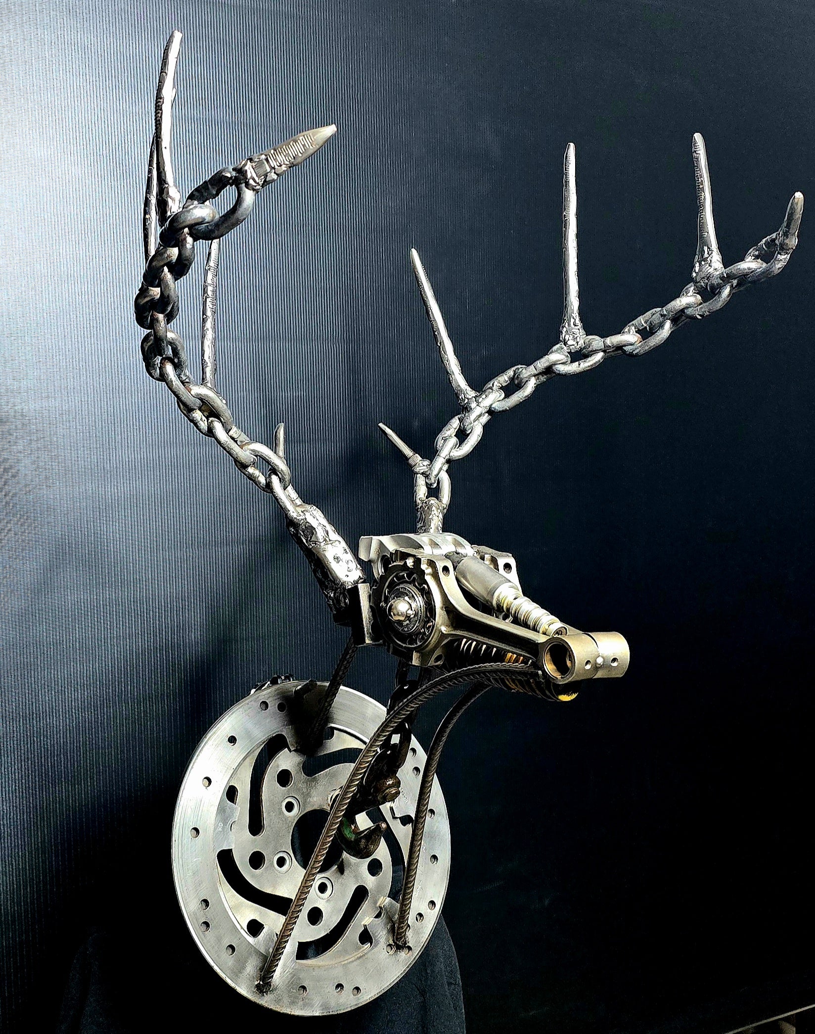 The Beast welded steel deer sculpture by Enrique Del Angel handcrafted from upcycled auto parts and bicycle chains