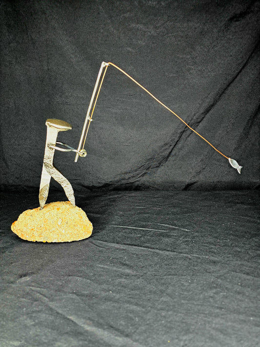 The Fisherman metal sculpture by Enrique Del Angel, handcrafted from a reclaimed railroad spike.
