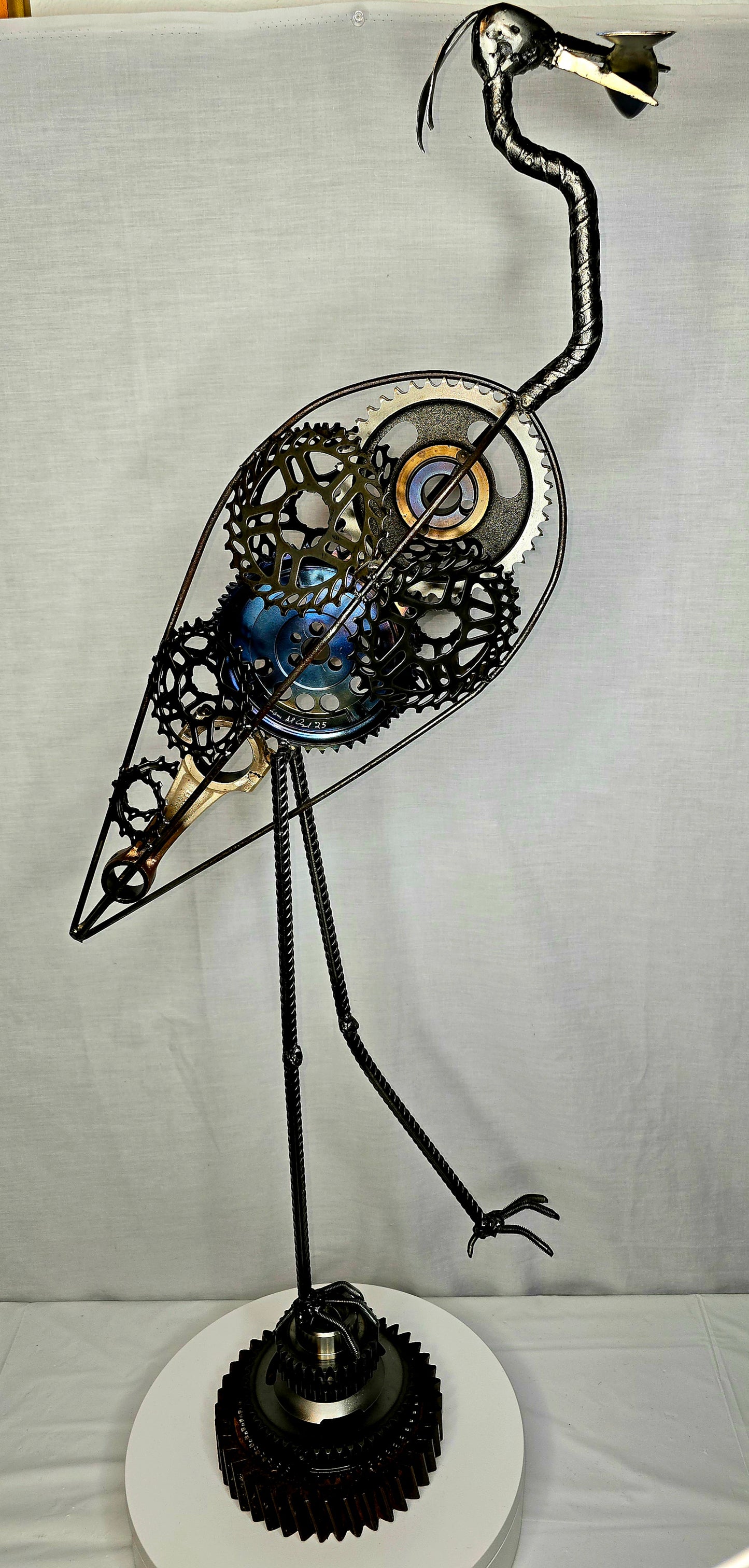 Great blue heron metal sculpture forged from reclaimed steel and found objects by Enrique Del Angel.