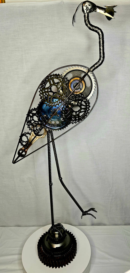 Great blue heron metal sculpture forged from reclaimed steel and found objects by Enrique Del Angel.