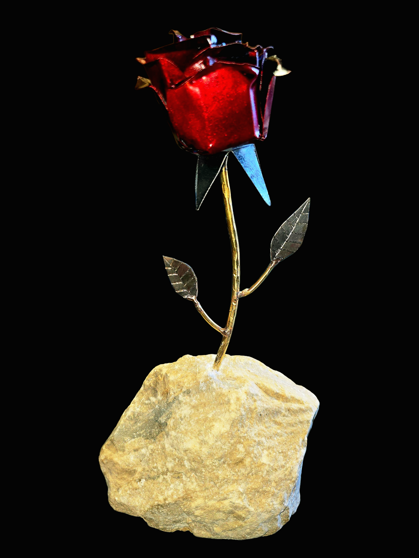Rose inspired metal sculpture with natural stone, symbolizing healing and renewal, forged from reclaimed steel by Enrique Del Angel.