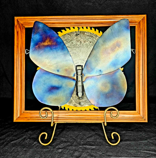 The Transformation: From Cocoon to Flight, a metal butterfly sculpture by Enrique Del Angel.