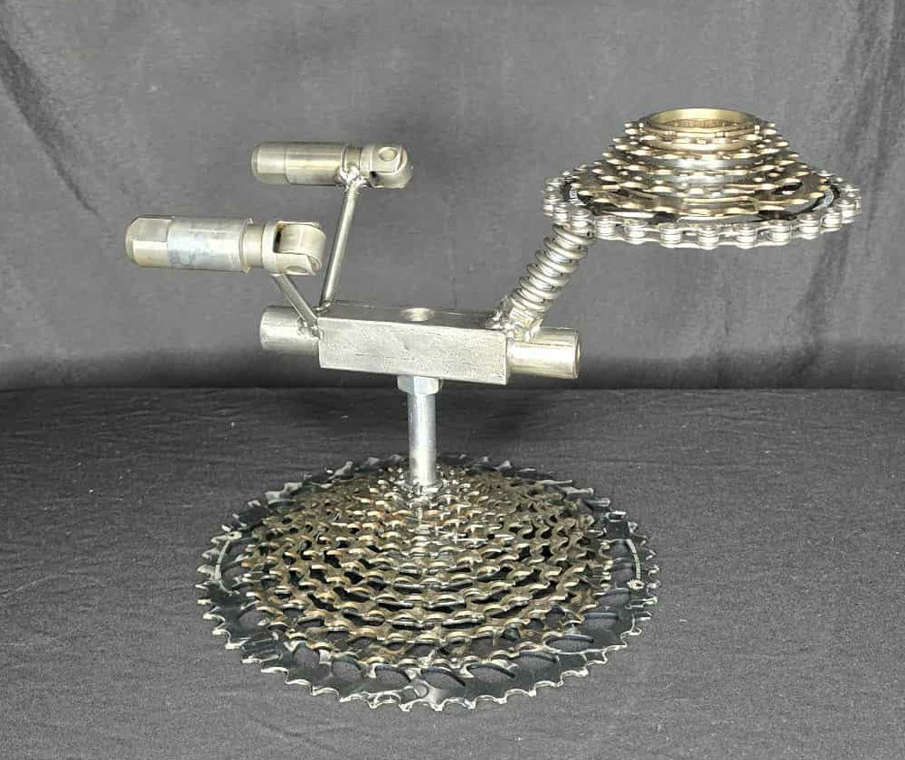 Sci fi inspired metal sculpture celebrating exploration and discovery, forged from reclaimed steel by Enrique Del Angel.