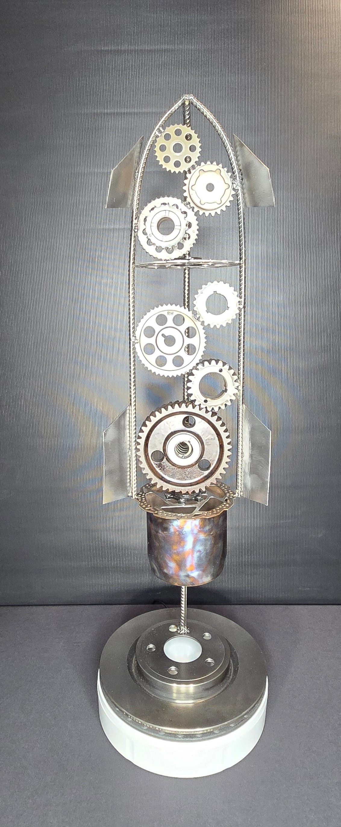 Voyage to Mars welded steel rocket, inspired by Space X Starship, sculpture by Enrique Del Angel handcrafted from upcycled automotive engine parts and gears