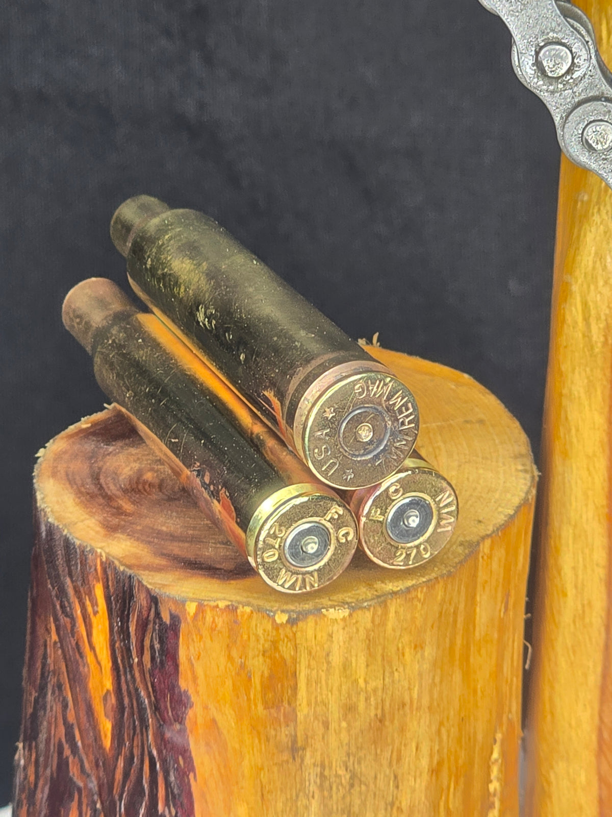 Where the Brass Falls, the Lone Star Rises sculpture: spent brass shell casings on wood base.
